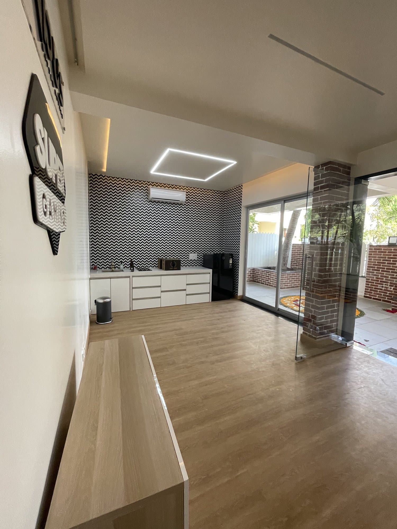 The transformed pantry — a tiled feature wall, floating cabinetry and a sliding door to the terrace
